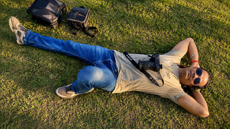 Filmmaker Raman Rishi Dwivedi resting with his camera during a documentary shoot