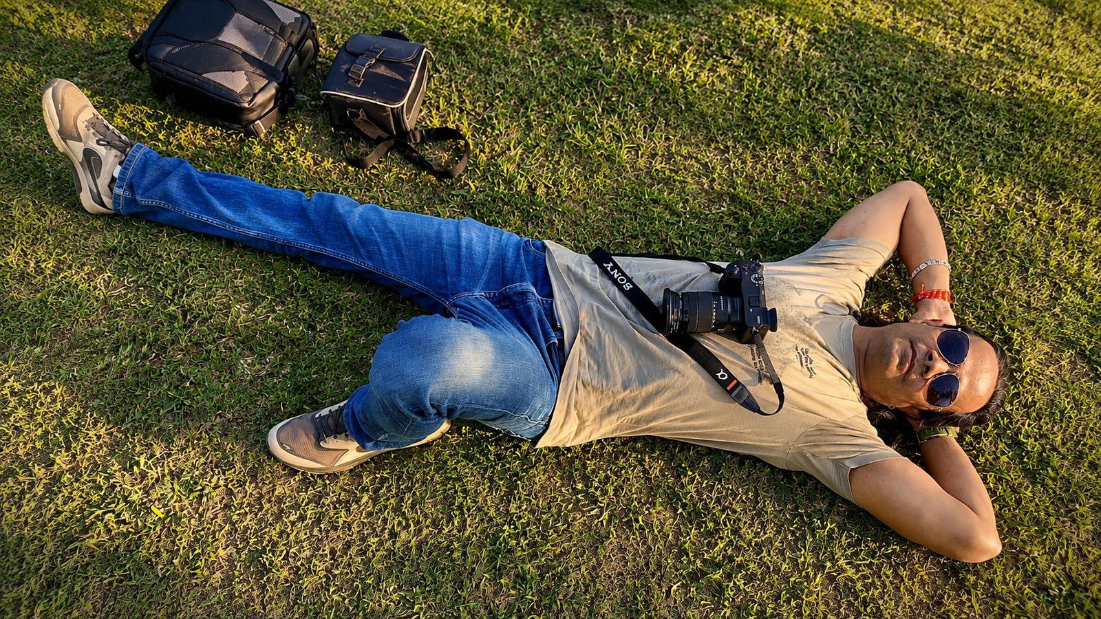 Filmmaker Raman Rishi Dwivedi resting with his camera during a documentary shoot